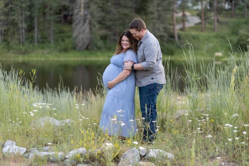 Expecting parents during maternity photoshoot in the mountains